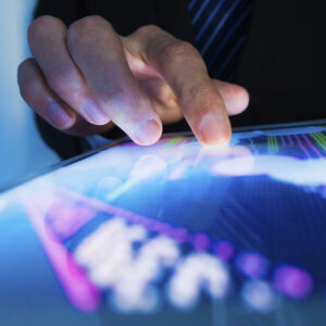 Fingers are shown on a touchpad