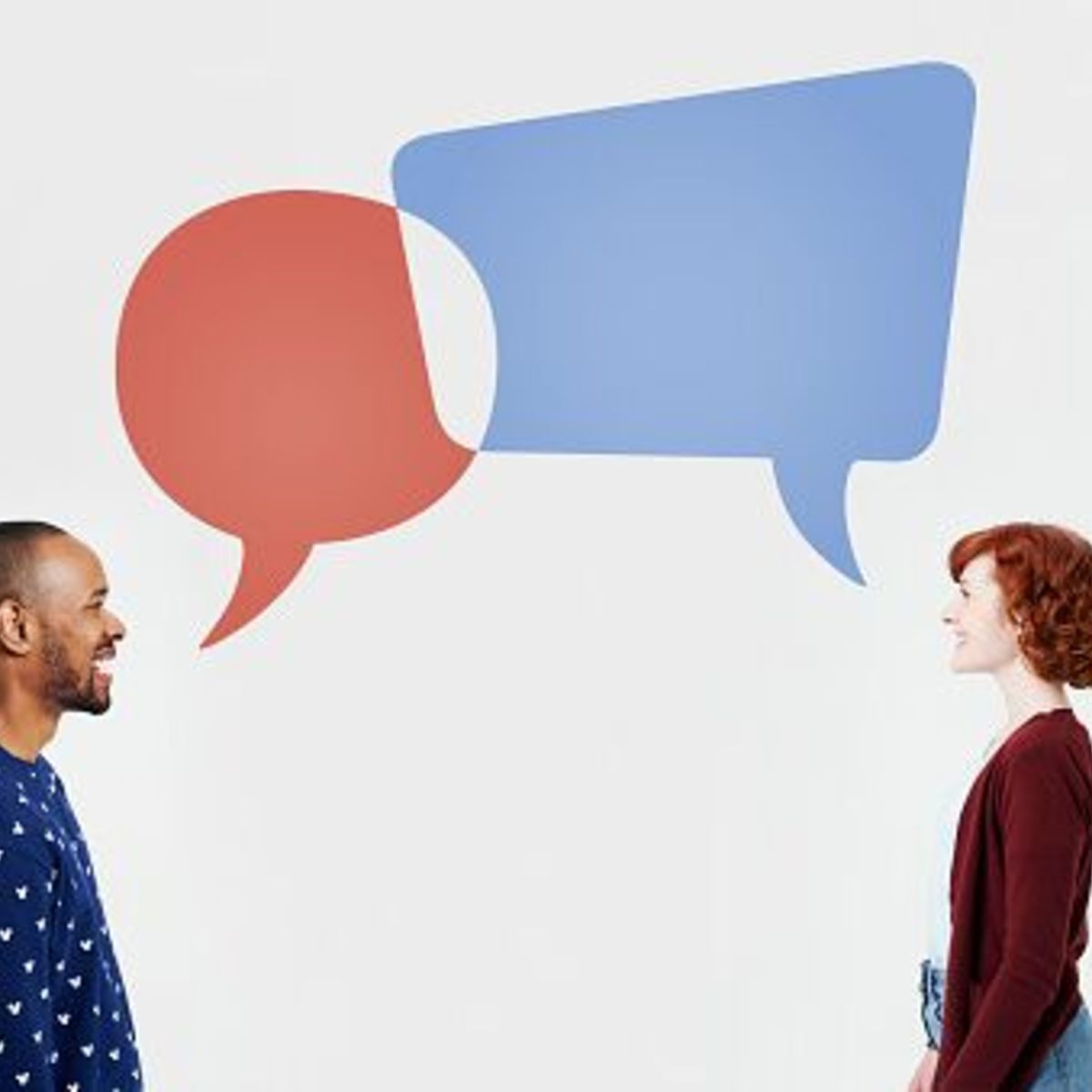 Two people facing each other with speech bubbles coming out of their mouths