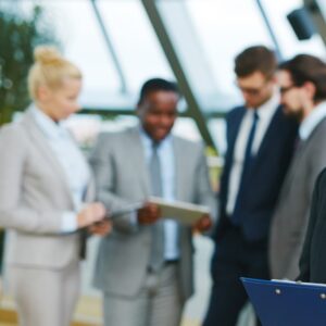 Men and women meeting in a business setting