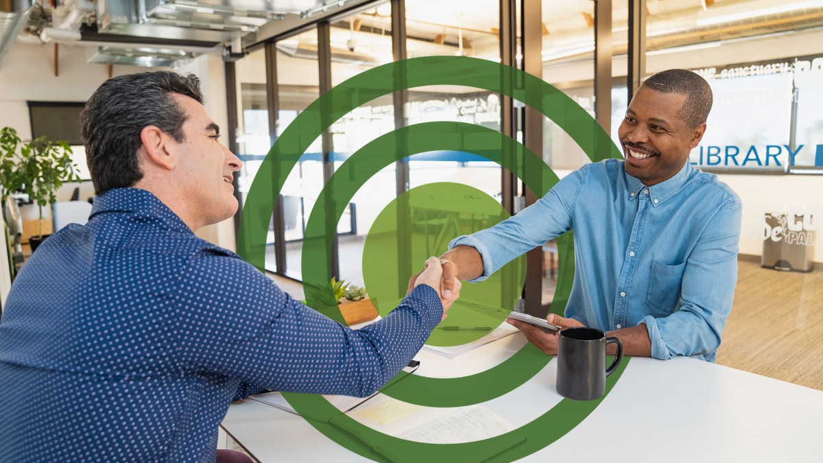 Two business people shaking hands.