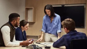 A group of people meet in a business setting.