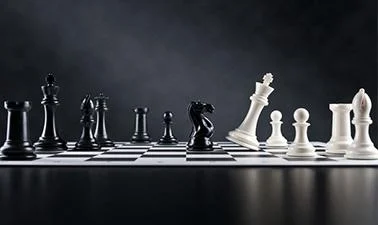 A chess board is shown. The queen is being knocked over.
